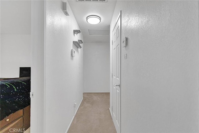 corridor with light colored carpet