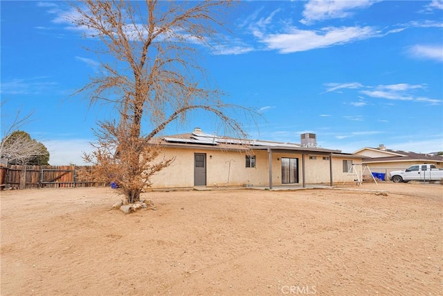 rear view of house with solar panels