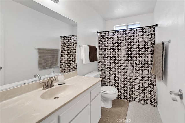 bathroom featuring vanity, toilet, curtained shower, and tile patterned flooring