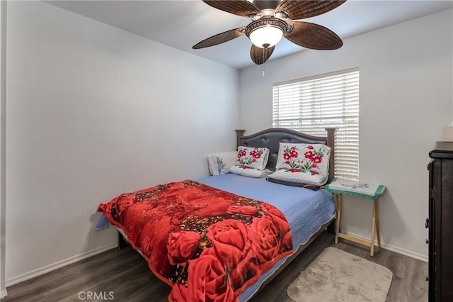 bedroom featuring ceiling fan and dark hardwood / wood-style flooring