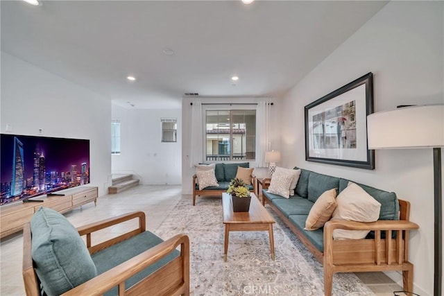 living room with a healthy amount of sunlight and light tile patterned floors