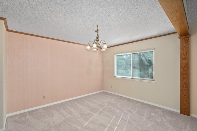 spare room featuring a notable chandelier, crown molding, light colored carpet, and a textured ceiling