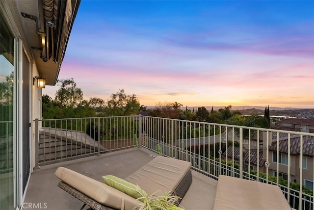 view of balcony at dusk