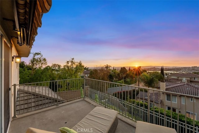 view of balcony at dusk