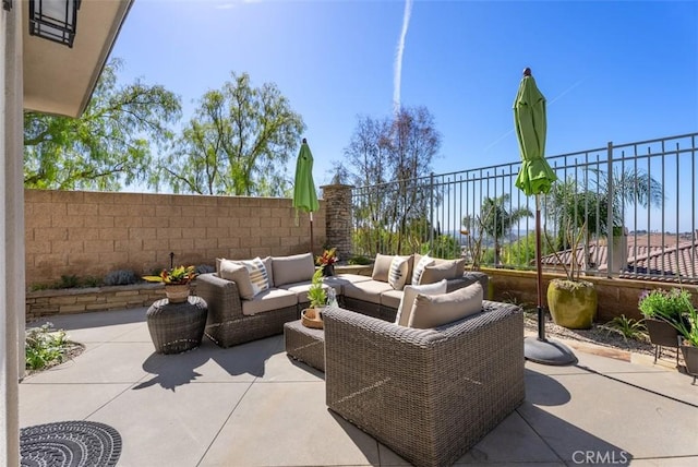 view of patio / terrace with outdoor lounge area and a fenced backyard