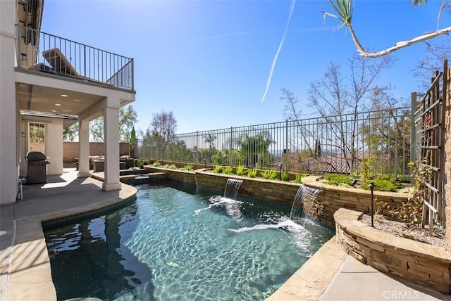 view of swimming pool with a patio area, grilling area, a fenced in pool, and a fenced backyard