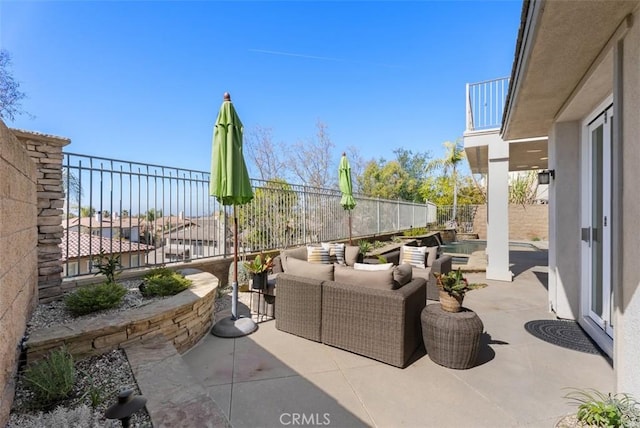 view of patio with outdoor lounge area and fence