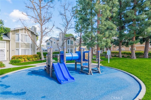 view of playground with a lawn