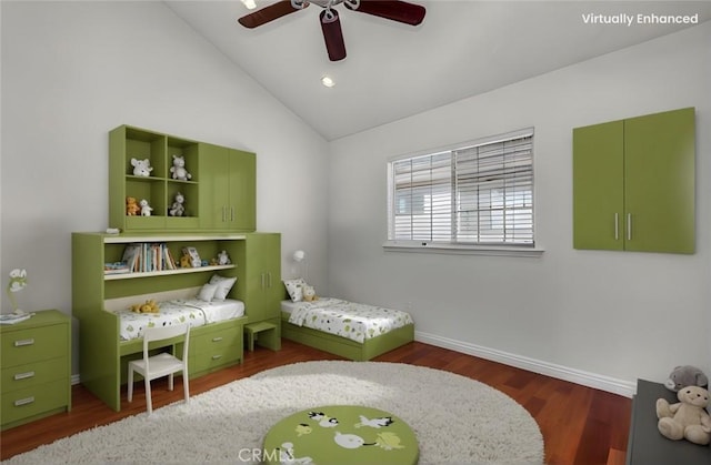 bedroom with ceiling fan, dark hardwood / wood-style floors, and vaulted ceiling