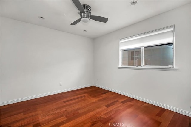 empty room with wood-type flooring and ceiling fan