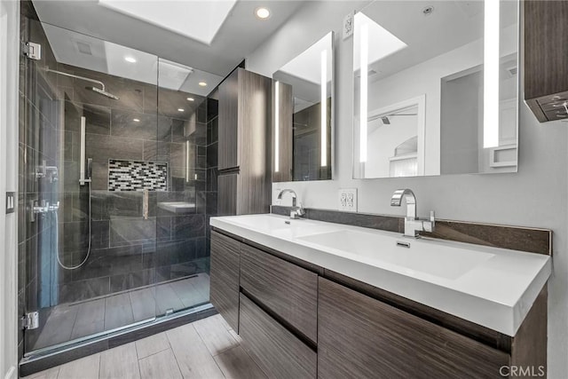 bathroom with vanity and walk in shower