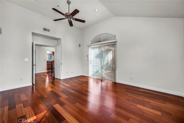 empty room with high vaulted ceiling, dark hardwood / wood-style floors, and ceiling fan