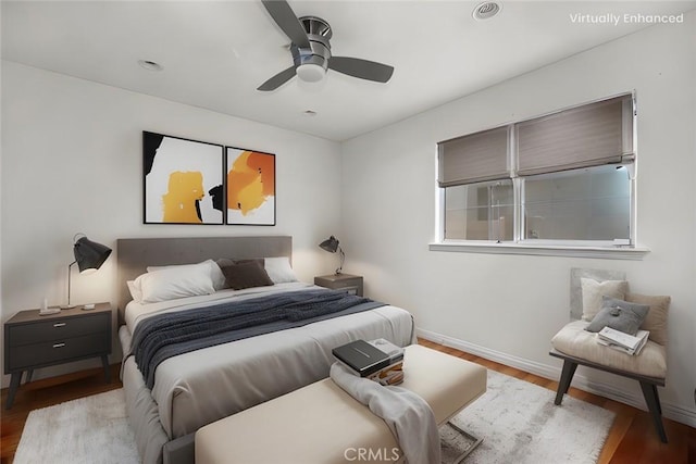 bedroom with ceiling fan and light wood-type flooring