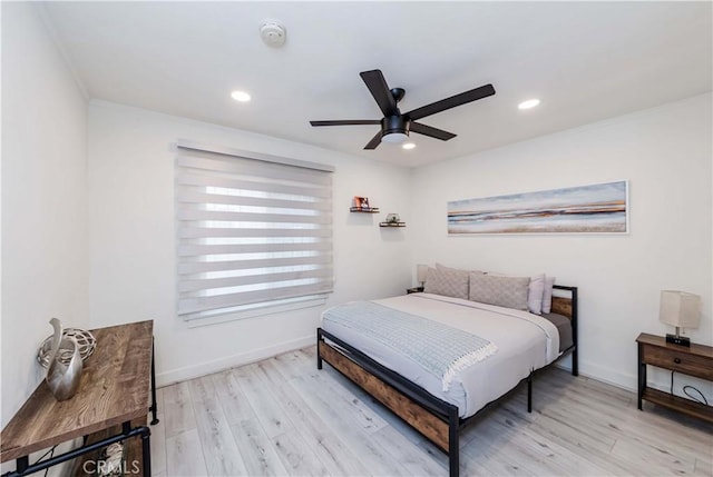 bedroom featuring ceiling fan and light hardwood / wood-style flooring