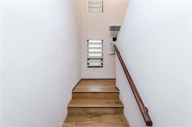 stairs with wood-type flooring