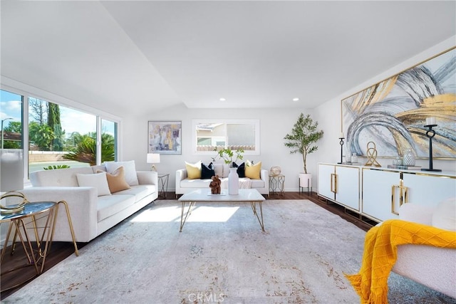 living room with dark wood-type flooring and vaulted ceiling