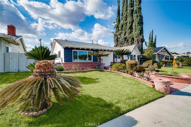 ranch-style house featuring a front lawn