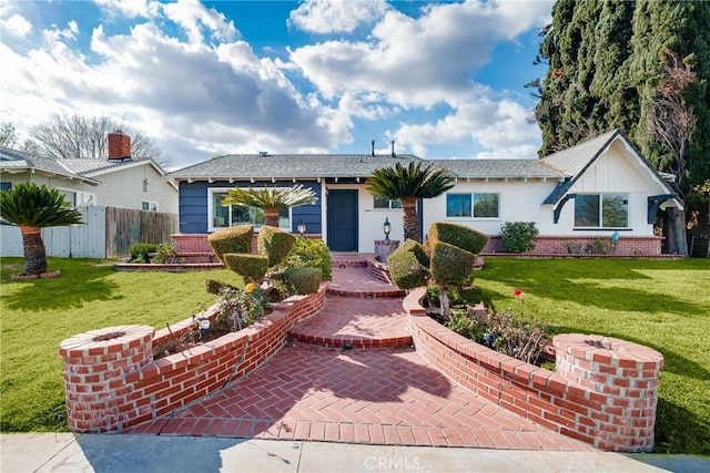 single story home with a front lawn