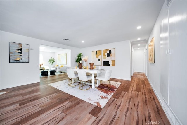 dining area featuring hardwood / wood-style floors