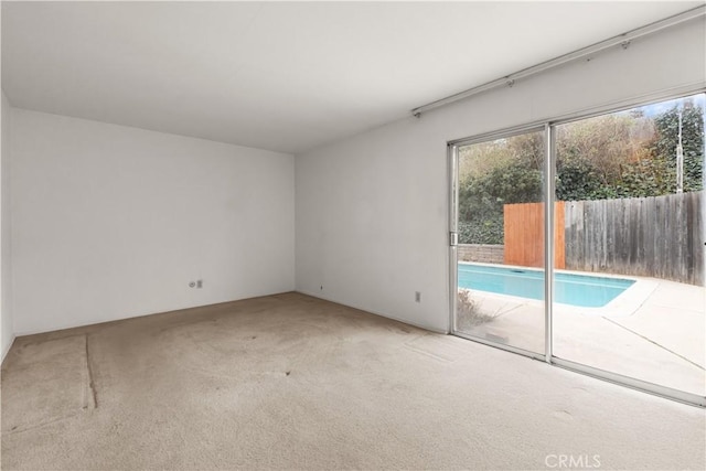 empty room featuring carpet flooring