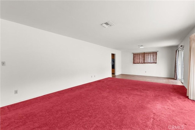 unfurnished living room with carpet