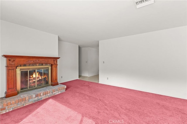 unfurnished living room featuring light carpet and a fireplace