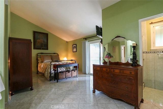 tiled bedroom with lofted ceiling