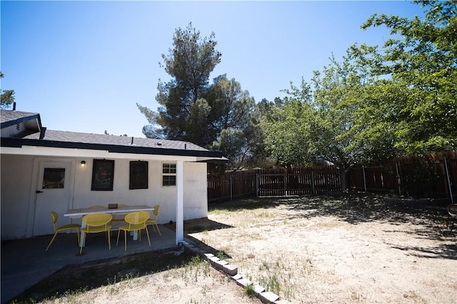 view of yard featuring a fenced backyard and a patio area