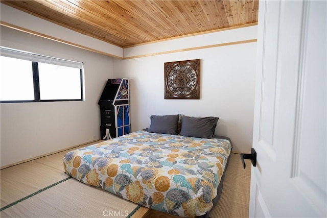 bedroom featuring wooden ceiling
