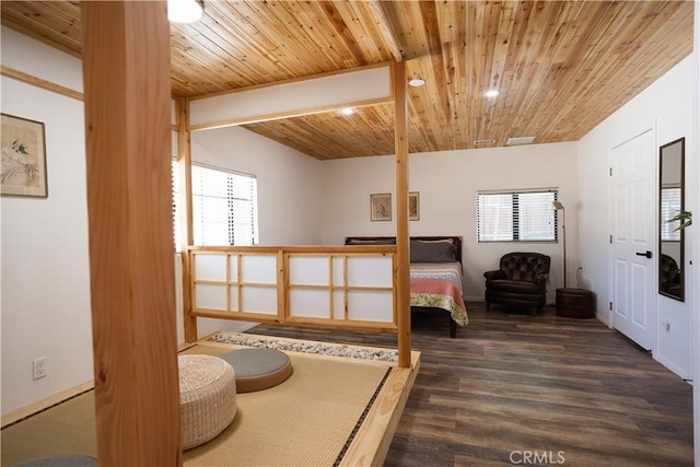 bedroom featuring wood finished floors, wooden ceiling, and multiple windows