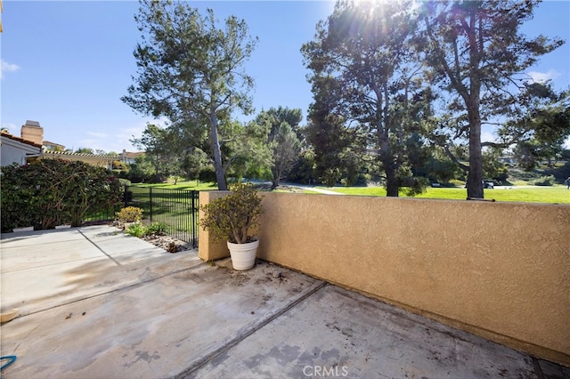 view of patio featuring fence