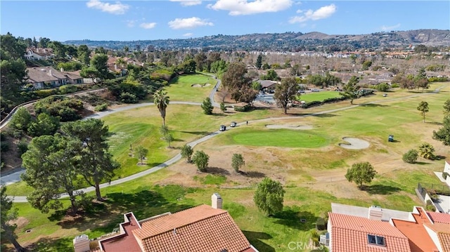 birds eye view of property with view of golf course