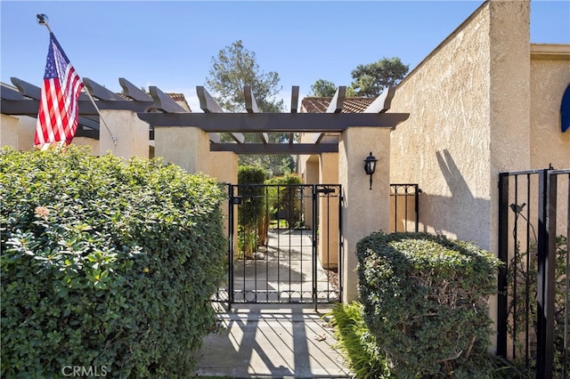 view of gate with fence