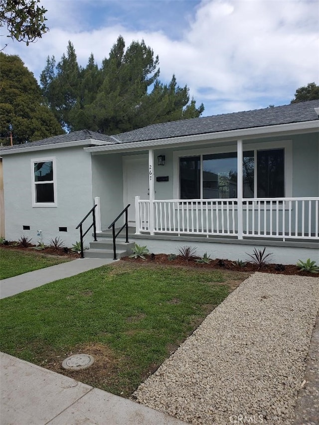 single story home with a front lawn and a porch