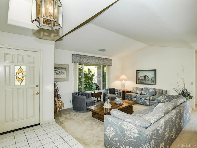 living room featuring carpet, lofted ceiling, visible vents, a chandelier, and tile patterned floors