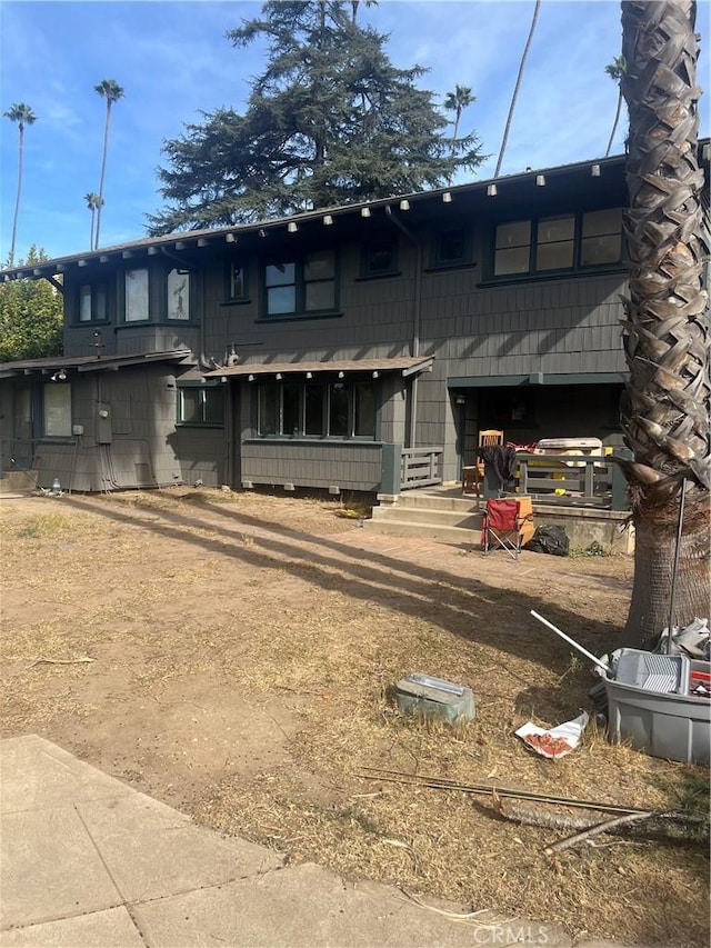 back of property featuring a garage