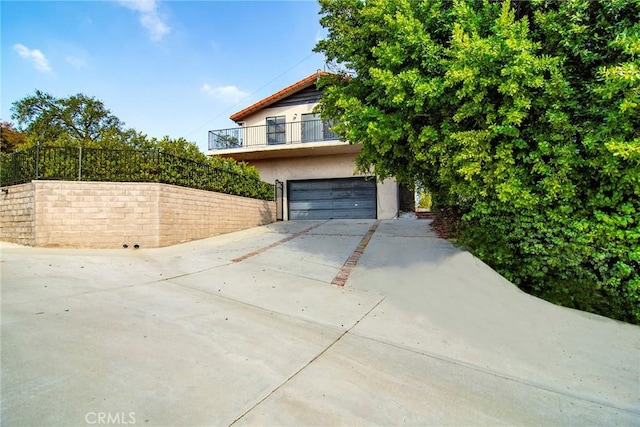 view of side of home featuring a garage