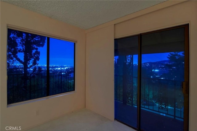 spare room featuring a textured ceiling