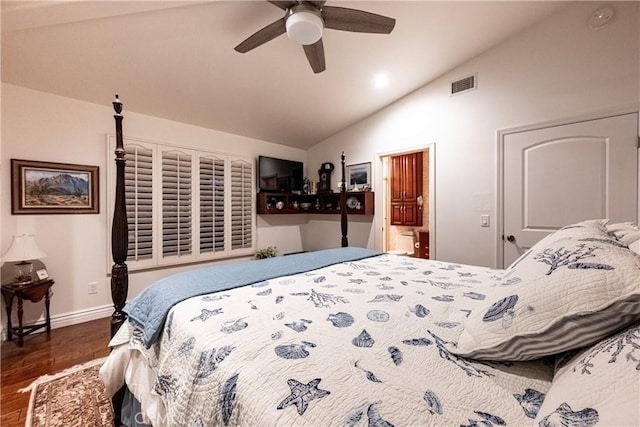 bedroom with baseboards, visible vents, dark wood finished floors, ceiling fan, and vaulted ceiling