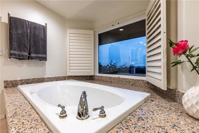 full bathroom with a tub to relax in