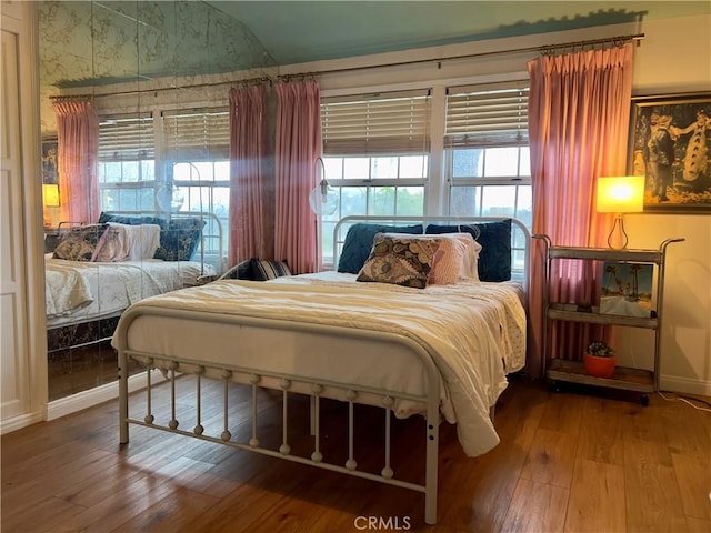 bedroom with hardwood / wood-style flooring