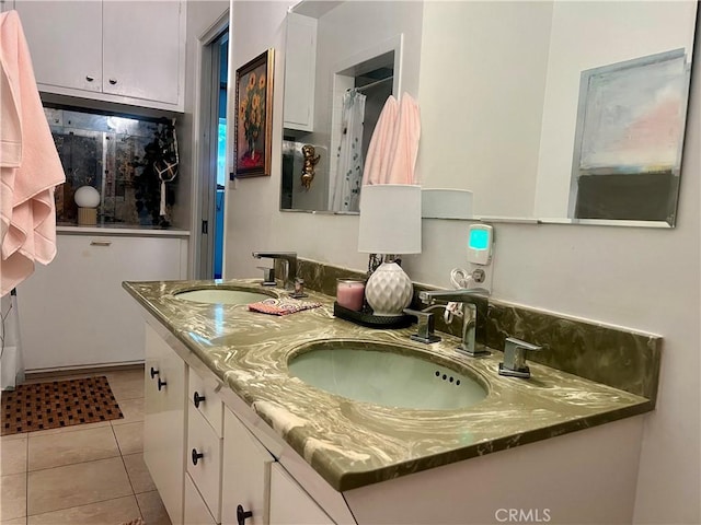 bathroom with vanity and tile patterned floors