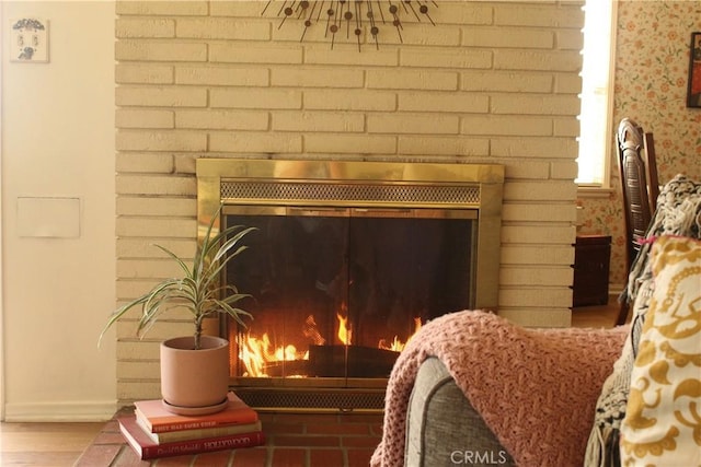 details featuring a brick fireplace