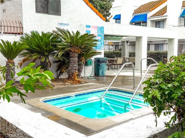 view of pool featuring a community hot tub