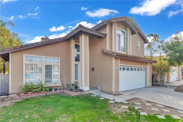 view of front of house with a garage and a front yard