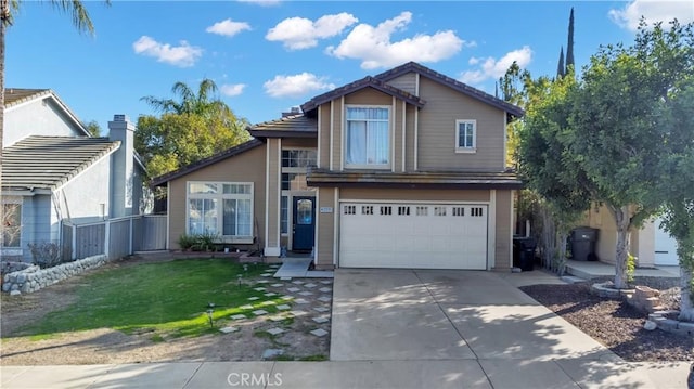 view of front of property with a garage and a front yard