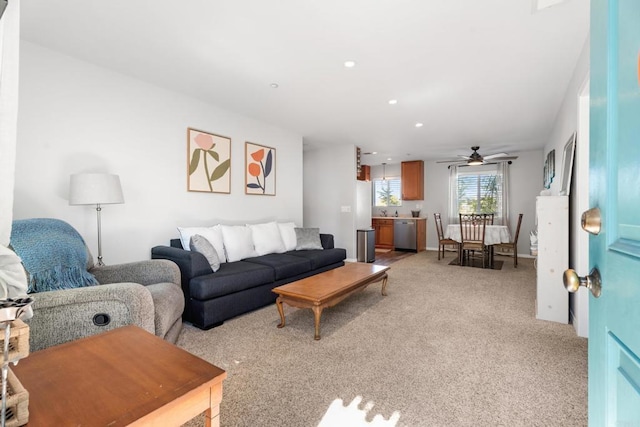 living room featuring light colored carpet and ceiling fan