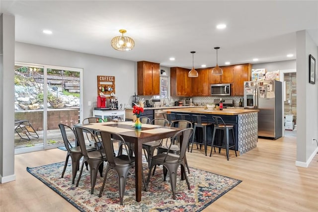 dining room with light wood-type flooring