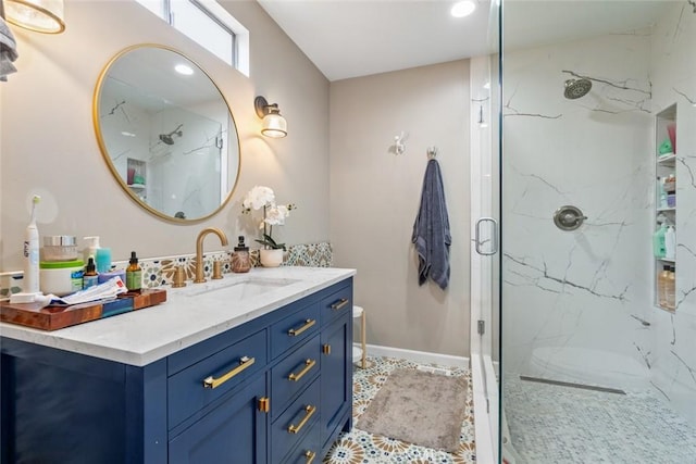 bathroom with vanity and a shower with door