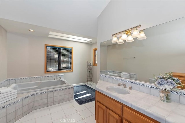 bathroom featuring vanity, tiled tub, and tile patterned floors